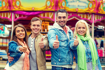 Image showing group of smiling friends showing thumbs up