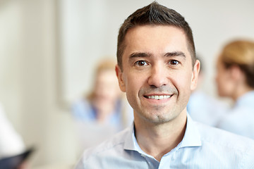 Image showing smiling businessman face in office