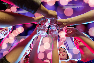 Image showing smiling friends with glasses of champagne in club