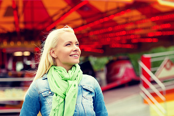 Image showing smiling young woman in amusement park