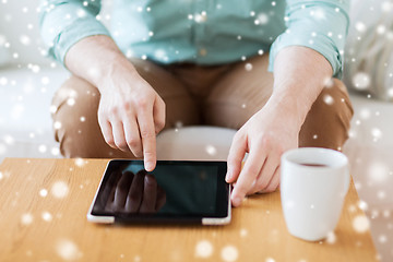 Image showing close up of man with laptop and cup at home