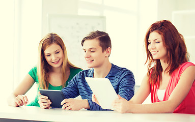 Image showing smiling students with tablet pc at school