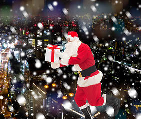 Image showing man in costume of santa claus with gift box