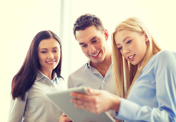 Image showing business team working with tablet pc in office