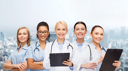 Image showing smiling female doctors and nurses with stethoscope