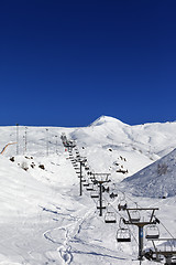 Image showing Winter mountains and ski slope at nice day