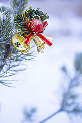 Image showing Vertical shot of christmas decoration on natural fir 