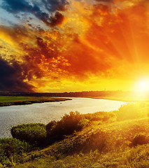 Image showing fantastic red sunset over river