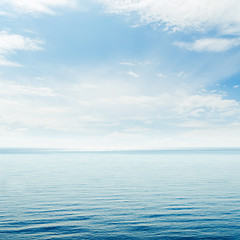 Image showing blue sea and cloudy sky over it