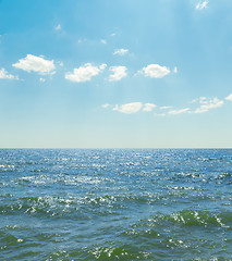 Image showing waves on sea and blue sky with clouds