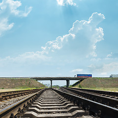 Image showing railway goes to horizon under bridge with autos