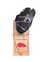 Image showing Modern computer mouse in a mousetrap