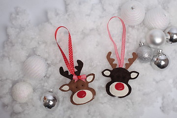 Image showing Christmas deer and balls on snow