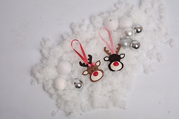 Image showing Christmas deer and balls on snow