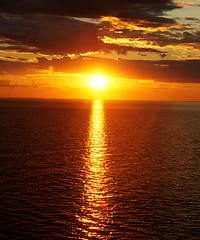 Image showing Bright sunset over water.