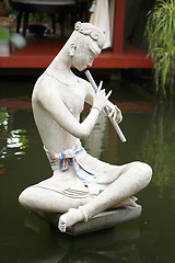 Image showing Boy playing the flute