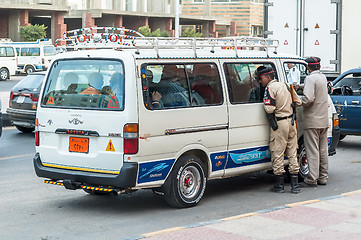 Image showing Egyptian Police Officers check vehicle