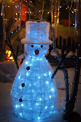 Image showing Snowman snow Christmas display with twinkling lights wonderland