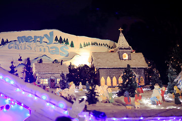 Image showing Merry Christmas and village scene with church