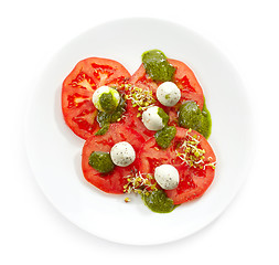 Image showing Plate of tomato and goat cheese balls salad