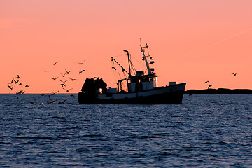 Image showing Fishing boat in Silhouette