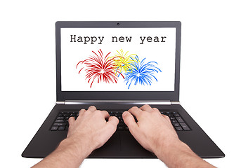 Image showing Man working on laptop, happy new year