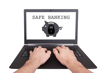 Image showing Man working on laptop, safe banking