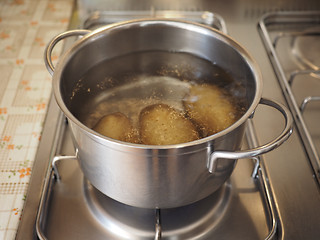 Image showing Saucepot with potatoes on cooker