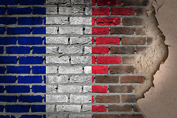 Image showing Dark brick wall with plaster - France