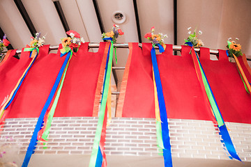 Image showing Bouquets with stripes hanging on wall