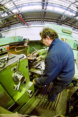 Image showing Milling-machine operator works at  machine