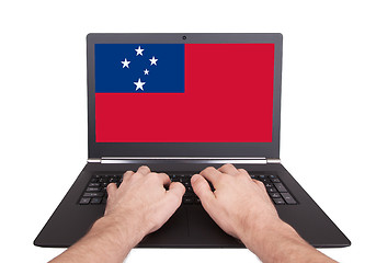 Image showing Hands working on laptop, Samoa