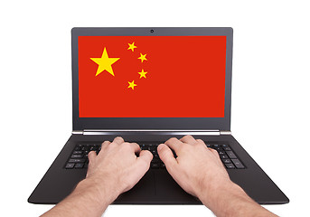 Image showing Hands working on laptop, China