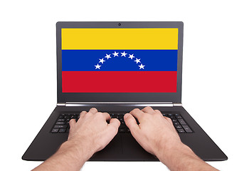 Image showing Hands working on laptop, Venezuela