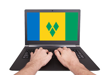 Image showing Hands working on laptop, Saint Vincent and the Grenadines