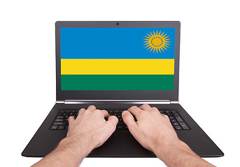 Image showing Hands working on laptop, Rwanda