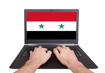 Image showing Hands working on laptop, Syria