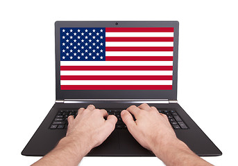 Image showing Hands working on laptop, USA