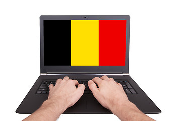 Image showing Hands working on laptop, Belgium