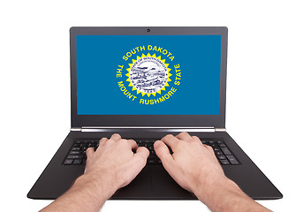 Image showing Hands working on laptop, South Dakota