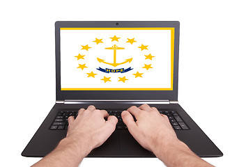 Image showing Hands working on laptop, Rhode Island