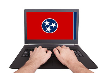 Image showing Hands working on laptop, Tennessee