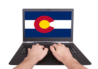 Image showing Hands working on laptop, Colorado