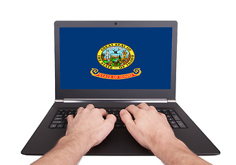 Image showing Hands working on laptop, Idaho