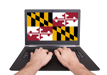 Image showing Hands working on laptop, Maryland