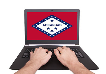 Image showing Hands working on laptop, Arkansas