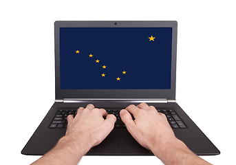 Image showing Hands working on laptop, Alaska