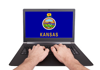 Image showing Hands working on laptop, Kansas