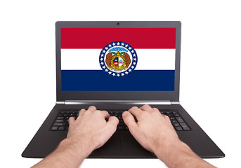 Image showing Hands working on laptop, Missouri