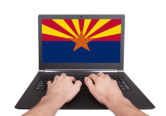 Image showing Hands working on laptop, Arizona